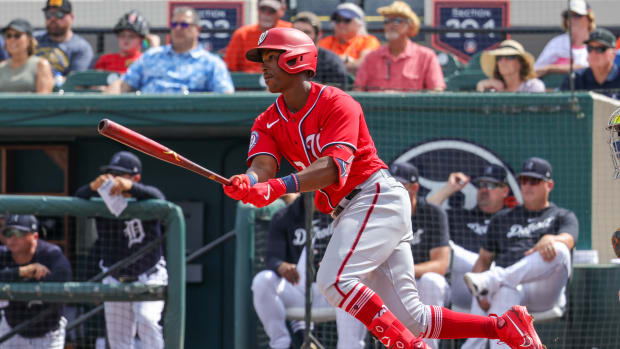 Mar 8, 2023; Lakeland, Florida, USA; Washington Nationals second baseman Jeter Downs (3) hits a single during the fourth inning against the Detroit Tigers at Publix Field at Joker Marchant Stadium.