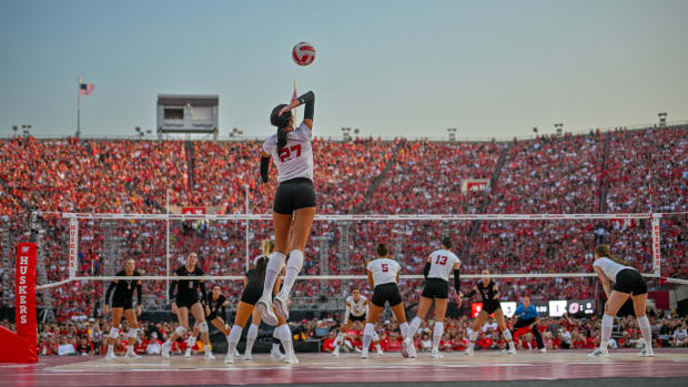 Nebraska volleyball in front of a packed Memorial Stadium.