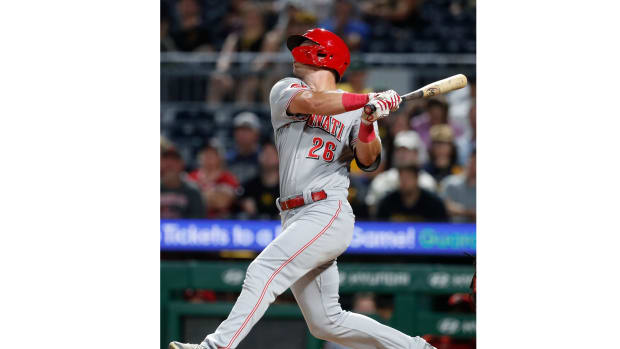 Cincinnati Reds right fielder TJ Hopkins hits a single against the Pittsburgh Pirates during the tenth inning at PNC Park. (2023)
