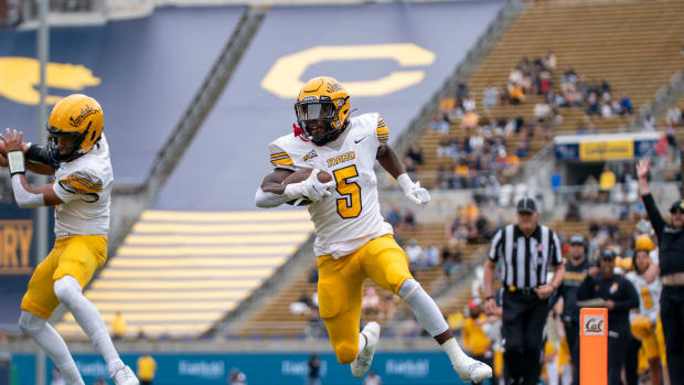  September 16, 2023; Berkeley, California, USA; Idaho Vandals running back Anthony Woods (5) scores a touchdown against the California Golden Bears during the first quarter at California Memorial Stadium. Mandatory Credit: Kyle Terada-USA TODAY Sports