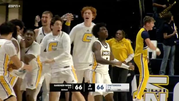 Chattanooga players celebrate after Trey Bonham’s half-court game-winner
