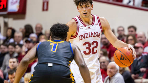 Dec 19, 2023; Bloomington, Indiana, USA; Indiana Hoosiers guard Trey Galloway (32) dribbles the ball while Morehead State Eagles guard Jerone Morton (1) defends in the second half at Simon Skjodt Assembly Hall. Mandatory Credit: Trevor Ruszkowski-USA TODAY Sports
