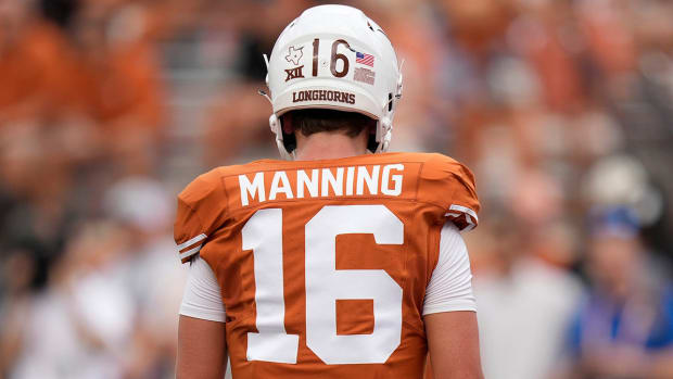 Texas quarterback Arch Manning warms up before a game against BYU.