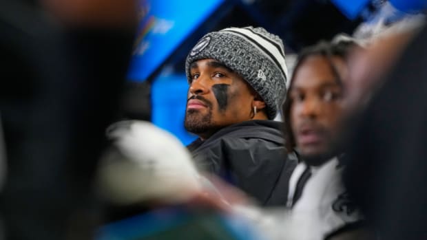 Philadelphia Eagles quarterback Jalen Hurts looks on from the bench during the first half of an NFL football game against the Seattle Seahawks, Monday, Dec. 18, 2023, in Seattle. (AP Photo/Lindsey Wasson)