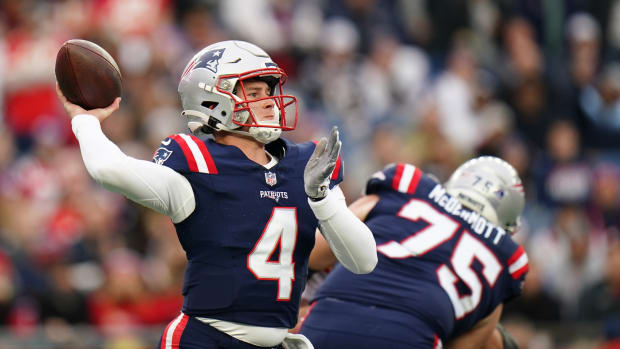 New England Patriots quarterback Bailey Zappe (4) throws a pass against the Kansas City Chiefs in the first quarter at Gillette Stadium.