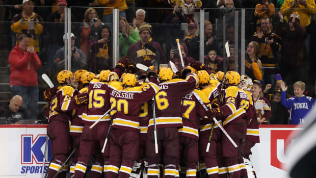 Gophers hockey players celebrate a win during the 2023-24 season.