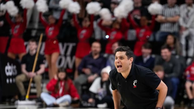 Cincinnati Bearcats head coach Wes Miller calls out to his defense in the second half of the NCAA basketball game between the Merrimack Warriors and the Cincinnati Bearcats at Fifth Third Arena in Cincinnati on Tuesday, Dec. 19, 2023. The Bearcats won 65-49.