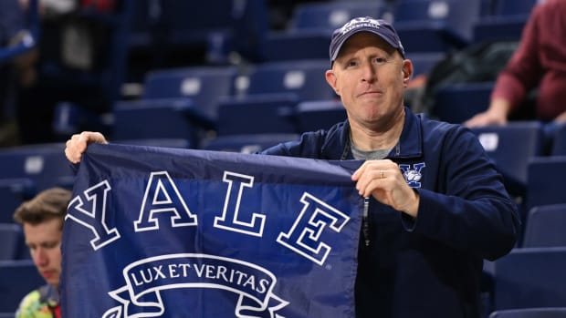 Nov 10, 2023; Spokane, Washington, USA; Yale Bulldogs fan holds a school flag during a game against the Gonzaga Bulldogs at McCarthey Athletic Center. Mandatory Credit: James Snook-USA TODAY Sports  