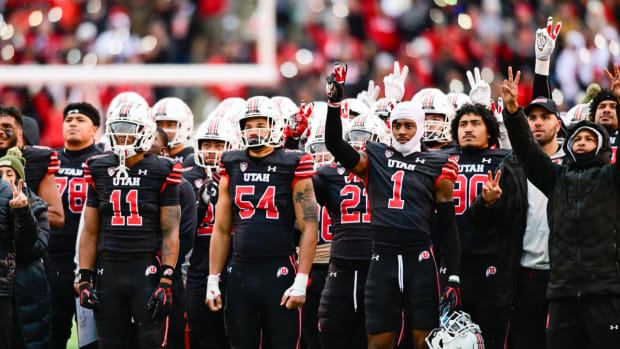 Utah football players gesture during the fourth quarter of their win over Colorado.
