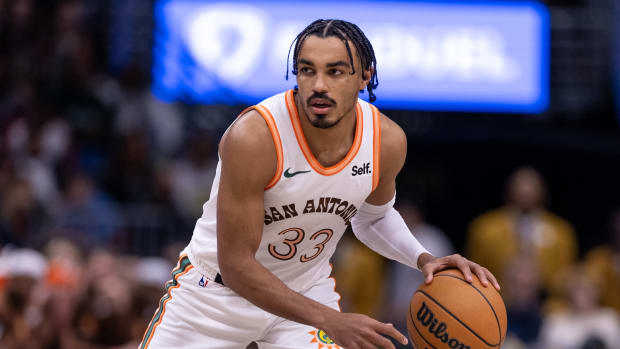 Dec 1, 2023; New Orleans, Louisiana, USA; San Antonio Spurs guard Tre Jones (33) brings the ball up court against the New Orleans Pelicans during the second half at the Smoothie King Center.