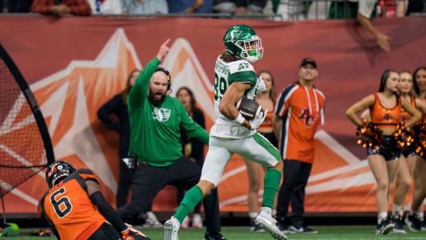 Aug 26, 2022; Vancouver, British Columbia, CAN; Saskatchewan Roughriders wide receiver Kian Schaffer Baker (89) runs past injured BC Lions defensive back T.J. Lee (6) on his way to score a touchdown in the first half at BC Place. Mandatory Credit: Bob Frid-USA TODAY Sports  