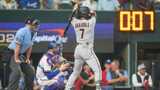 Arizona Diamondbacks outfielder Corbin Carroll bats during the 2023 World Series with the pitch timer at seven seconds in the background.