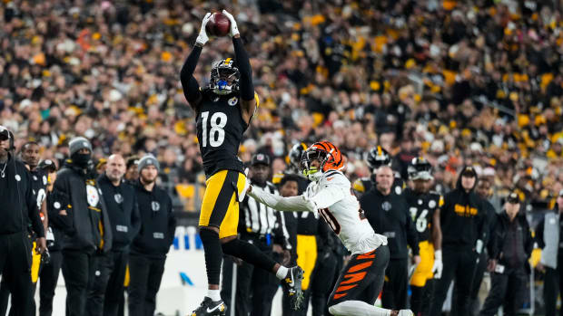 Pittsburgh Steelers wide receiver Diontae Johnson (18) catches a deep pass over Cincinnati Bengals cornerback DJ Turner II (20) in the second quarter of the NFL 16 game between the Pittsburgh Steelers and the Cincinnati Bengals at Acrisure Stadium in Pittsburgh on Saturday, Dec. 23, 2023. The Steelers led 24-0 at halftime.
