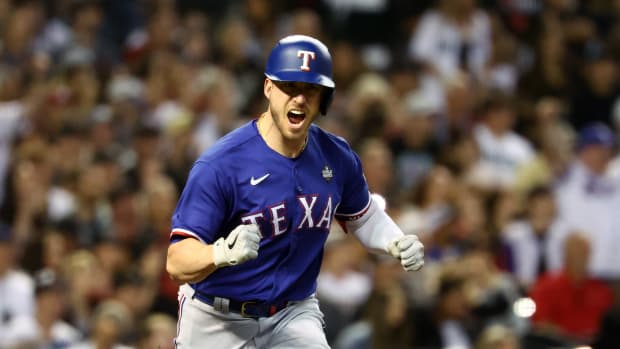 Nov 1, 2023; Phoenix, Arizona, USA; Texas Rangers catcher Mitch Garver (18) reacts after hitting a RBI single against the Arizona Diamondbacks during the sixth inning in game five of the 2023 World Series at Chase Field.