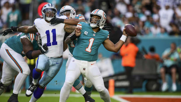Dec 24, 2023; Miami Gardens, Florida, USA; Miami Dolphins quarterback Tua Tagovailoa (1) throws the football against the Dallas Cowboys during the first quarter at Hard Rock Stadium. 
