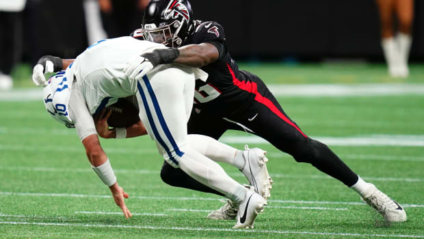 Atlanta Falcons defensive end Zach Harrison (96) takes down Indianapolis Colts quarterback Gardner Minshew (10) during the first half at Mercedes-Benz Stadium.