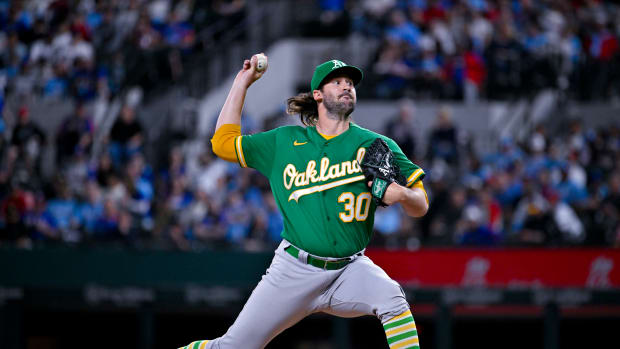 Apr 23, 2023; Arlington, Texas, USA; Oakland Athletics relief pitcher Chad Smith (30) pitches against the Texas Rangers during the game at Globe Life Field. Mandatory Credit: Jerome Miron-USA TODAY Sports