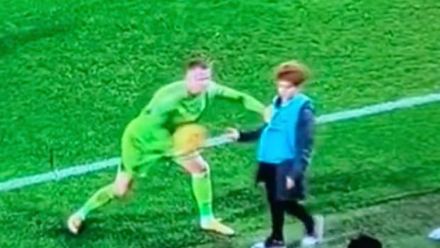 Fulham goalkeeper Bernd Leno pictured (left) pushing a Bournemouth ball boy during a Premier League game on Boxing Day in 2023