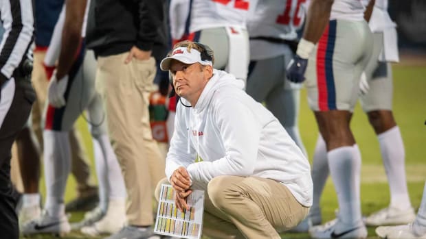 Ole Miss coach Lane Kiffin looks at the scoreboard during the 2023 Egg Bowl against Mississippi State.