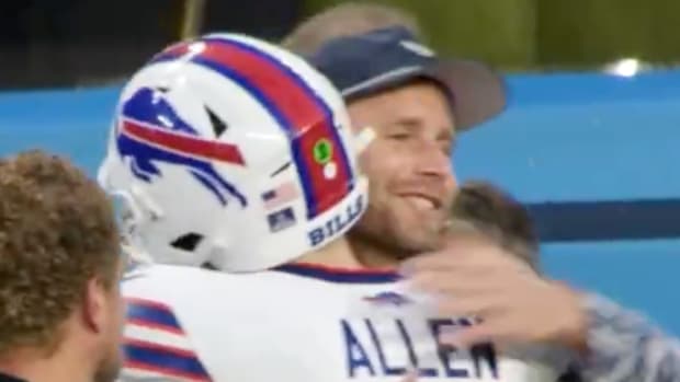 Bills quarterback Josh Allen hugs former kicker Stepehn Hauschka before a game.