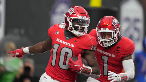 Dec 2, 2023; Las Vegas, NV, USA; UNLV Rebels linebacker Fred Thompkins (10) celebrates with defensive back Jerrae Williams (1) after intercepting a pass for a touchdown against the Boise State Broncos in the first half during the Mountain West Championship at Allegiant Stadium. Mandatory Credit: Kirby Lee-USA TODAY Sports