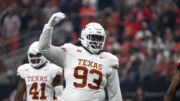 Texas Longhorns defensive lineman T'Vondre Sweat (93) celebrates a defensive stop during the Big 12 Championship game against the Oklahoma State Cowboys at AT&T stadium on Saturday, Dec. 2, 2023 in Arlington.  