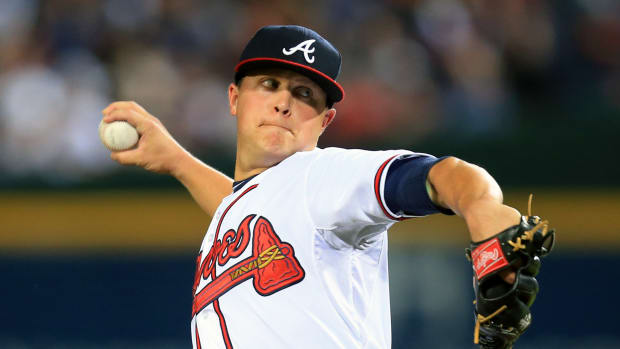 Oct 3, 2013; Atlanta, GA, USA; Atlanta Braves starting pitcher Kris Medlen (54) throws against the Los Angeles Dodgers during the fourth inning of game one of the National League divisional series playoff baseball game at Turner Field. Mandatory Credit: Daniel Shirey-USA TODAY Sports  