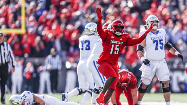 Louisville Cardinals defensive lineman Kameron Wilson (15) celebrates after sacking Kentucky Wildcats quarterback Devin Leary (13) in the first half. Nov. 24, 2023