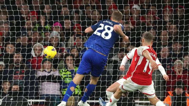 Tomas Soucek pictured (center) shooting to score for West Ham United against Arsenal in a Premier League game at the Emirates Stadium in December 2023