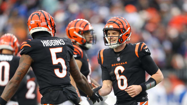 Dec 10, 2023; Cincinnati, Ohio, USA; Cincinnati Bengals quarterback Jake Browning (6) celebrates his touchdown run with wide receiver Tee Higgins (5) during the second half against the Indianapolis Colts at Paycor Stadium. Mandatory Credit: Joseph Maiorana-USA TODAY Sports
