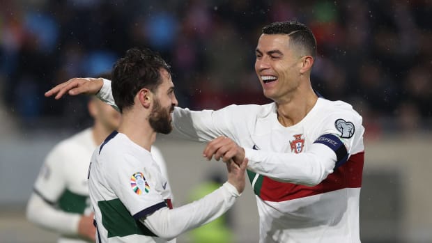 Cristiano Ronaldo (right) and Bernardo Silva pictured celebrating a goal for Portugal during a 6-0 away win against Luxembourg in March 2023