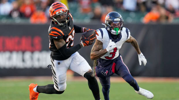 Cincinnati Bengals cornerback Cam Taylor-Britt (29) intercepts a pass intended for Houston Texans wide receiver Tank Dell (3) in the fourth quarter of the NFL Week 10 game between the Cincinnati Bengals and the Houston Texans at Paycor Stadium in downtown Cincinnati on Sunday, Nov. 12, 2023.  