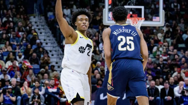 Dec 28, 2023; New Orleans, Louisiana, USA; Utah Jazz guard Collin Sexton (2) celebrates a three point basket against New Orleans Pelicans guard Trey Murphy III (25) during the fourth quarter at the Smoothie King Center. 