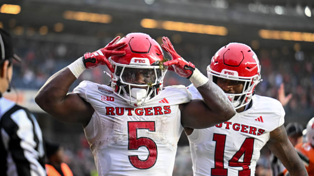 Rutgers Scarlet Knights running back Kyle Monangai (5) celebrates his touchdown against Miami Hurricanes during the second quarter with Rutgers Scarlet Knights wide receiver Isaiah Washington (14) at Yankee Stadium.