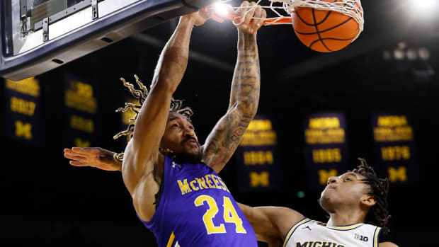 McNeese State Cowboys forward Christian Shumate (24) dunks on Michigan Wolverines forward Tarris Reed Jr. (32) in the second half at Crisler Center. 