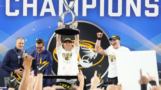  Missouri Tigers head coach Eliah Drinkwitz hoists the Field Scovell Trophy following their 14-3 win over the Ohio State Buckeyes in the Goodyear Cotton Bowl Classic at AT&T Stadium.