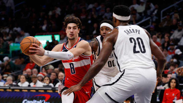 Dec 29, 2023; Washington, District of Columbia, USA; Washington Wizards forward Deni Avdija (8) drives to the basket past Brooklyn Nets forward Royce O'Neale (00) in the first quarter at Capital One Arena. Mandatory Credit: Geoff Burke-USA TODAY Sports