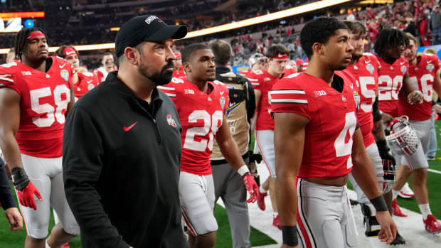 Ohio State Buckeyes head coach Ryan Day walks off the field after losing 14-3 to Missouri Tigers in the Goodyear Cotton Bowl Classic at AT&T Stadium.