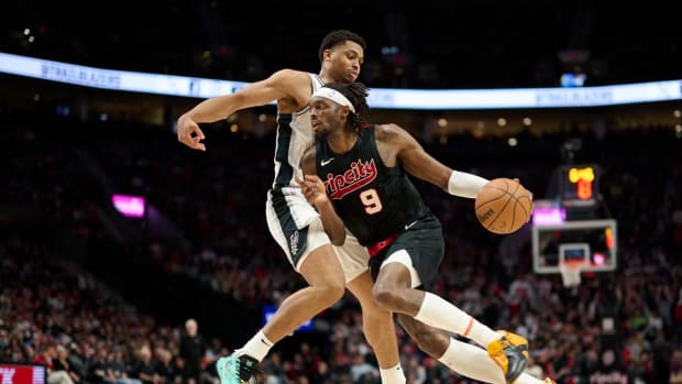 Portland Trail Blazers small forward Jerami Grant drives in against San Antonio Spurs forward Keldon Johnson during the two teams’ second straight matchup against each other in Portland.