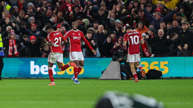 Three players from Nottingham Forest pictured celebrating a goal during a 2-1 win over Manchester United in December 2023