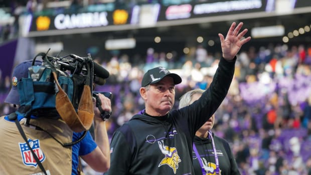 Jan 9, 2022; Minneapolis, Minnesota, USA; Minnesota Vikings head coach Mike Zimmer waves to the crowd as he leaves the field after the game against the Chicago Bears at U.S. Bank Stadium
