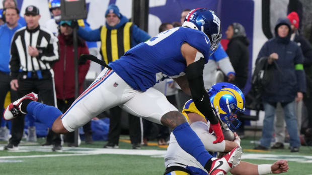 East Rutherford, NJ December 31, 2023 -- Isaiah Simmons of the Giants sacks Rams quarterback Matthew Stafford late in the game. The Los Angeles Rams edged the New York Giants 26-25 on December 31, 2023 at MetLife Stadium in East Rutherford, NJ.