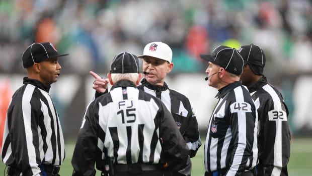 Referee Brad Allen talks with his referee crew during the second half of the game between the New York Jets and the Houston Texans at MetLife Stadium.