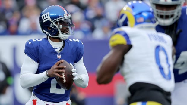 Dec 31, 2023; East Rutherford, New Jersey, USA; New York Giants quarterback Tyrod Taylor (2) drops back to pass against the Los Angeles Rams during the first quarter at MetLife Stadium.