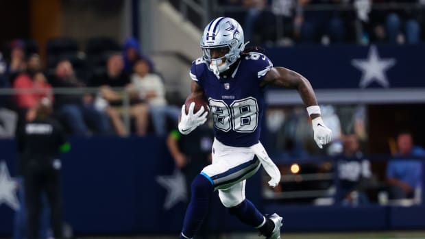 Dec 30, 2023; Arlington, Texas, USA; Dallas Cowboys wide receiver CeeDee Lamb (88) runs with the ball during the second half against the Detroit Lions at AT&T Stadium.