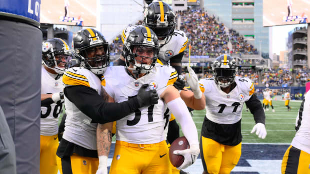 Pittsburgh Steelers linebacker Markus Golden (44) and linebacker Nick Herbig (51) and cornerback Joey Porter Jr. (24) celebrate after Herbig recovered a fumble against the Seattle Seahawks during the second half at Lumen Field.