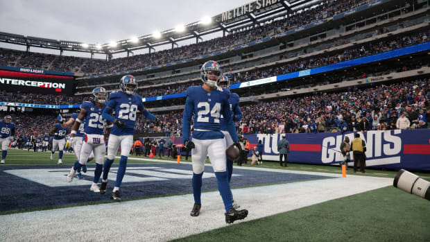 Dec 31, 2023; East Rutherford, New Jersey, USA; New York Giants safety Dane Belton (24) celebrates with teammates after an interception during the second half against the Los Angeles Rams at MetLife Stadium.