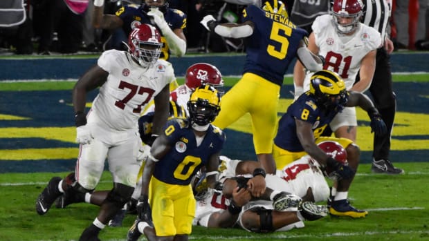 Michigan Wolverines defensive back Mike Sainristil (0) celebrates the final play of the Wolverines overtime win over Alabama Crimson Tide in the 2024 Rose Bowl college football playoff semifinal game at Rose Bowl.