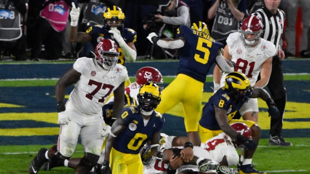 Jan 1, 2024; Pasadena, CA, USA; Michigan Wolverines defensive back Mike Sainristil (0) celebrates the Wolverines overtime win over Alabama Crimson Tide in the 2024 Rose Bowl college football playoff semifinal game at Rose Bowl.