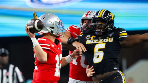 Missouri Tigers defensive lineman Darius Robinson (6) rushes Ohio State Buckeyes quarterback Lincoln Kienholz (12) during the second half of the Cotton Bowl at AT&T Stadium.